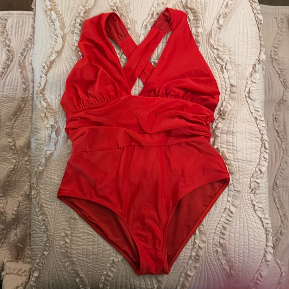 One piece red bathing suit with crisscross back